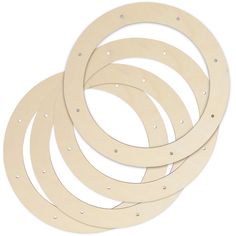 six pieces of wood with holes in the middle and one piece cut out to look like circles