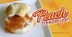 a close up of a doughnut on a plate with the words peach freeze jam