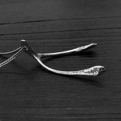 "In an effort to make a wishbone pendant as realistic as possible, I decided to cast it directly from a real wishbone replicating every minute detail in solid sterling. Every tiny detail of the bone texture has been captured and enhanced through oxidation and careful polishing. Being cast from a small turkeys wishbone, the shape is perfect and proportional. Measuring 2-1/8\" by 1-1/4\", The chain  passes directly through the top of the bone giving it a very clean uncluttered look." Bone Texture, Steampunk Gas Mask, Wishbone Pendant Necklace, Button Studs, Wishbone Necklace, Necklace Moon, Mask Necklace, To Cast, The Bone