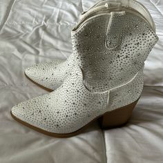 Brand New. Pointed Toe. White. Padded Soles. Heeled. Booties. Size 8. (I Am Usually A Size 8.5/9- These Run Small) *Pet Friendly Home *Smoke Free Home Summer Boots With Rhinestones And Round Toe, White Round Toe Booties For Party, White Round Toe Party Booties, White Rhinestone Boots For Fall, Western Style Party Boots With Flat Heel, Western Style Flat Heel Party Boots, White Rhinestone Boots With Round Toe, White Rhinestone Boots For Spring, White Party Booties For Spring