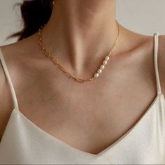 A Feminine And Parisian-Styled Necklace, Designed With A Mix Of A Paperclip Chain And A Set Of Freshwater Pearls. You May Place The Pearls At Different Positions (In The Center Or Side) To Align With Your Outfit. - 18k Gold Plated Titanium And Organic Freshwater Pearls - The Width Of The Paperclip Chain Is About 0.15” / 4mm - Length: 16.5” / 42cm In Total Length With 2” / 5cm Extension - Note: The Pearls May Look Slightly Different In Shapes And Texture - Tarnish-Resistant And Hypoallergenic White Clavicle Chain Necklace For Everyday, White Pearl Necklace With Delicate Metal Chain, Elegant White Necklace With Paperclip Chain, Pearl Necklace With Paperclip Chain, Everyday White Paperclip Chain Necklace, Ruby Heart Necklace, Feminine Jewelry, Paperclip Chain Necklace, Black Pearl Necklace