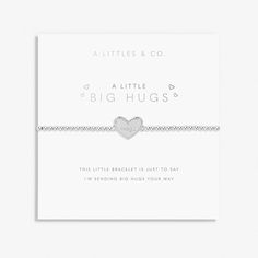 Celebrate all of life's treasured moments with those that mean the most with our ever-growing collection of A Littles. Featuring our signature beaded design that ensures a comfortable fit on any wrist, and crowned with a special silver-plated engraved heart charm to share a little love when the going gets tough, the A Little 'Big Hugs' Bracelet In Silver Plating comes carefully wrapped around a sentiment-stamped presentation card, ready to spread joy and make the sweetest addition to your loved one's stack. Silver-Plated One Size Fits All Nickle Free Inspirational Sterling Silver Friendship Bracelets, Personalized Inspirational Silver Beaded Bracelets, Inspirational Personalized Silver Beaded Bracelets, Adjustable Heart Bracelet With Silver Beads For Gift, Inspirational Silver Beaded Friendship Bracelets, Inspirational Silver Beaded Bracelets As Gift, Adjustable Sterling Silver Stretch Bracelet Gift, Silver Jubilee Stretch Bracelet As Gift, Silver Stretch Bracelet Gift For Mother's Day