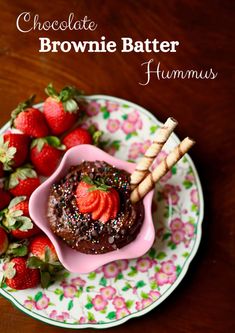 chocolate brownie batterer hummus on a plate with strawberries