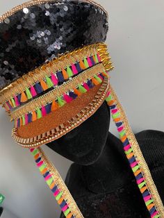 Dazzle Tassel is bringing the festival vibes once again and we love her! Black sequins, gold studs and multicoloured tassels. Handmade with all your celebrations in mind. Any questions, just ask. 💜 Hat circumference 23 inches / 60 centimetres Bohemian Headpiece For Mardi Gras Party, Bohemian Headpiece For Carnival, Carnival Beaded Adjustable Headpieces, Carnival Adjustable Beaded Headpiece, Adjustable Headpiece For Carnival Festival, Adjustable Headpieces For Carnival Festival, Bohemian Headpieces For Mardi Gras Carnival, Bohemian Headpiece For Carnival Party, Bohemian Headpieces For Carnival Festival