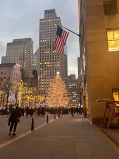 a large christmas tree in the middle of a city