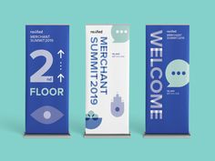 three blue and white roll up banners with the words welcome to michigan, two for floor