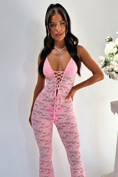 Unleash your inner diva with our Alfonzo Jumpsuit! Made with stunning floral lace material, this jumpsuit features a tie up halter neckline, lace up detailing down the center, and double lined busts for ultimate comfort and support. The flared legs add a touch of elegance, making it perfect for your next night out. Style her with simple heels and gold jewellery for a perfect emsemble! Please note: underwear not included FABRICATION: 100% Polyester SIZING: Crystal's height is 162cm/5'3 and wears Pink Birthday Outfit, Nicki Concert, Nicki Minaj Concert, Outfit Recreation, Crop Outerwear, Simple Heels, Orange Swimwear, Cute Streetwear, Night Out Style