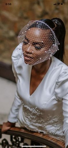 a woman wearing a veil on top of her head