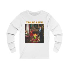 This funny Christmas-themed unisex long sleeve t-shirt features all the characters from the top best Christmas movies we all love, such as Clark Griswold from National Lampoon Christmas Vacation, The Grinch and his dog Max, Kevin from Home Alone and Buddy Elf. With the text 'Thug Life,' this t-shirt is sure to be a hit at the Christmas party and the best winner of the Ugly Sweater Contest. Perfect for Christmas celebrations and movie lovers. Product features - 100% ring-spun cotton for durability and smooth fabric - Classic fit with crew neckline for versatile style - Ethically grown and harvested US cotton for sustainability - Ribbed knit collar highly elastic and retains shape - Great for printing with specially spun fibers Care instructions - Do not dryclean - Machine wash: warm (max 40 Ugly Sweater Contest Winner, National Lampoon Christmas Vacation, National Lampoon Christmas, Buddy Elf, Christmas Movie Characters, Ugly Sweater Contest, National Lampoon, Clark Griswold, Best Christmas Movies