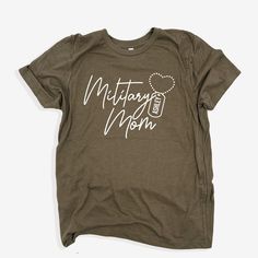 Personalized Military Mom shirt, Military Mom gift, Proud Military Mom T-shirt, Custom Military Mom tee, Mama Military gift, Deployment gift, Army Mom Tee  👚How To Order Your Apparel 👕 This is a physical item which means once you purchase, receive an order confirmation and tracking within 3-5 days. You will be able to track your item once it is updated with a tracking number which you can find in your purchases section.  🗳 How we print our apparel  ➡️ We do not carry pre-printed shirts.  Once you place your order it goes into our production process with our production partner. We print our shirts using Direct To Garment printing technology. Unlike other garments decorating processes, this process allows for a super soft print that will last for years. The ink is eco and kid friendly.  P Mother's Day Gift T-shirt With Screen Print, Green Graphic Tee For Mother's Day, Mother's Day Green Short Sleeve T-shirt, Green Short Sleeve T-shirt For Mother's Day, Mother's Day Green Graphic Tee, Graphic Print Tee Shirt As Gift, Mother's Day Crew Neck Shirt With Text Print, Graphic Tee With Custom Print For Mother's Day, Mother's Day Screen Print Short Sleeve T-shirt