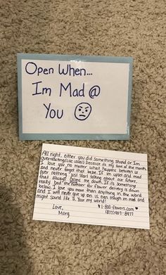 a sign that says open when i'm mad at you next to a note