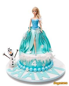 a frozen princess cake with a snowman on top