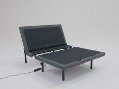 a bed frame with an electric cord attached to it