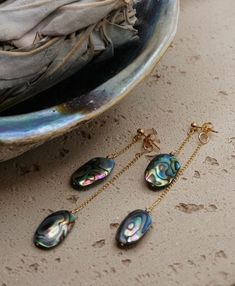 Holy Abalone-y, these are COOL.  Measuring 2 1/2 inch back drop length, 1 1/2 front drop length with genuine Abalone shells measuring approximately 1 1/2-2cm x 1cm. Made with 14k gold fill materials, very light weight, tarnish resistant, and hypoallergenic. Abalone Earrings, Dangle Earrings Gold, Jewelry Chain, Gold Filled Earrings, Huggie Earrings, Gold Earrings Dangle, Abalone Shell, Chain Earrings, Gold Filled Jewelry