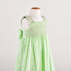 a green dress with pink flowers on it