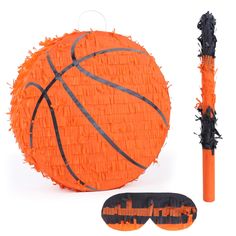 an orange pinata with black trim around it and a pair of sunglasses next to it