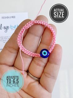 At last. You asked and I made it happen. Simple, neat, and clean. My first ever official evil eye baby bracelet. Comfortable, lightweight, snug and adjustable. Intricately handwoven to perfection. Bracelet can be used as anklet as well. Measured 4 inches to 6.5 inches. This can be for a NB to teenager. Waterproof. Non tarnish with a classic OG evil eye bead. OG meaning all shades of blue are in each amulet. Comes in your choice of 3 neutral colors. Baby pink Baby blue White. The most perfect gif Eye Description, Perfect Gif, Baby Bracelet, Baby Protection, Protection Bracelet, Pretty Packaging, Fine Jewels, Pink Baby, Braided Bracelets