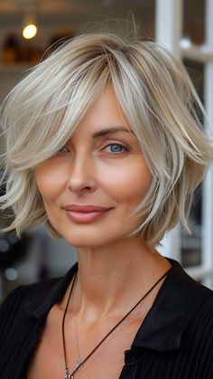 22 Hairstyles Enhancing Round-Faced Older Women's Beauty Hair Up Bob Length, Wispy Chin Length Hair, Chin Length Hair With Side Bangs, Messy Bob For Fine Hair, Short Choppy Blonde Bob, Hair Thinning Techniques For Thick Hair, Chic Chin Length Hair, Choppy Bob With Side Swept Bangs, Cute Short Cuts For Women