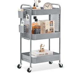 a metal cart with various items on it and a clock in the back ground next to it