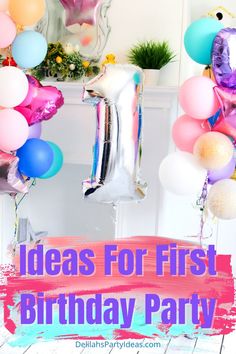 the first birthday party with balloons and streamers