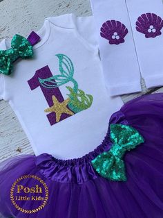 "Mermaid BIRTHDAY SET-Mermaid outfit TOP INFO: Our best seller birthday set professionally heat pressed with purple glitter -mermaid green glitter vinyl \"1-2-3-4-5-6-7\" Age Can be made in other numbers as well. Please leave a note to seller during checkout your preferences. S/S means Short Sleeves L/S means Long Sleeves TUTU INFO: Tutu embellished with brooched pin bow for easy removal and care! Tutus will be made according to your top size. 3 full layers. Stretchy waist with 6\", 8\", 11\" le Mermaid Smash Cake, Mermaid Bodysuit, Girl Birthday Outfit, Mermaid Birthday Outfit, Mermaid Green, Mermaid Birthday Party Decorations, Glitter Mermaid, Minnie Mouse Outfits