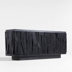 a black piece of art that looks like it is made out of wood