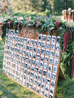 a wooden sign with photos and greenery on it