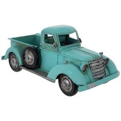 an old blue truck is shown on a white background