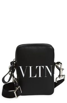 The bold VLTN logo printed in optic white makes a bold statement on a compact leather bag perfect for stashing the essentials. Top zip closure Removable, adjustable crossbody strap Leather Made in Italy Designer Logo Pouch Shoulder Bag, Luxury Shoulder Bag With Logo Print For Travel, Luxury Logo Print Shoulder Bag For Travel, Luxury Rectangular Shoulder Bag With Logo Print, Designer Black Bag With Logo Print, White Shoulder Bag With Logo For Everyday Use, Modern Pouch Bag With Logo, Rectangular Travel Bags With Logo Print, Rectangular Travel Bag With Logo Print