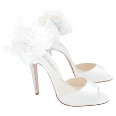 Absolutely exquisite wedding from Brian Atwood’s limited edition bridal collection. bought for £1200 and are unworn with box and spare heel tips (Box has a few marks). Superbly crafted from thick cream silk satin, they have stunning faux pearl trimmed floral corsages on the side. These have been supplied by the Atelier Lemarie which is the legendary workshop that makes Chanel’s camellias. They have crystal embellished sturdy high heels and leather thong straps to ankles - can be worn with or wit Luxury Glamorous Wedding Shoes With 4-inch Heel, Luxury High Heel Wedding Shoes With Crystal Embellishments, Crystal-embellished Wedding Shoes With Ankle Strap, White Crystal Embellished Open Heel Heels, White Crystal-embellished Wedding Shoes, Crystal Heels, Wedding Shoes Heels, Cream Silk, Brian Atwood