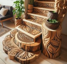 a wooden stair case sitting on top of a hard wood floor next to a potted plant