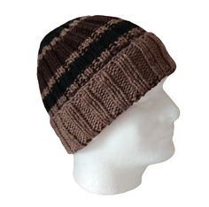 The chunky yarn and turned up brim on this hand knit hat will keep the wearer's ears toasty warm. The yarn is super soft merino and the colors are very masculine; dark brown and black set apart by light brown stripes. There is a resilience and bounce to wool fiber when you squeeze it that you get only with pure wool. And wool is best for keeping your head warm when those winter winds blow. This hat will stretch up to 23" and will fit an older boy or man with a smaller head. Item #591 - Chunky striped watch cap Fiber - Merino wool Color - Dark brown, light brown and black Size - Stretches to 23" around Care - Hand wash with cool water and mild soap (I use plain shampoo) Squeeze out water. Do not twist. Pat into shape and air dry flat. To see my other watch caps, click here: https://www.etsy Watch Cap, Hand Knit Hat, Black Set, Small Hands, Skull Cap Beanie, Chunky Yarn, Skull Cap, Merino Wool, Caps Hats