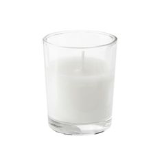 a white candle in a glass on a white background