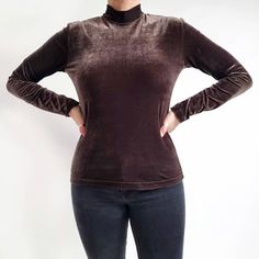 Beautiful vintage stretchy top in brown velvet jersey. It has a simple, fitted shape, a high neckline and long sleeves. The fabric is soft and stretchy. A perfect wardrobe staple for wearing on its own or under a blazer or cardigan for extra warmth. Made in Great Britain by Country Casuals.  96% polyester, 4% elastane. Labelled as size Large, could also fit Medium too Measurements when laid flat are: Pit to pit: 47cm Waist: 44cm Hemline: 47cm Sleeve length: 60cm Length: 60cm. Excellent condition Winter Velvet Long Sleeve Tops, Fitted Brown Long Sleeve Turtleneck, Fitted Brown Turtleneck With Long Sleeves, Velvet Long Sleeve Tops For Fall, Fall Velvet Long Sleeve Tops, Velvet Turtleneck, Pleated Shirt Dress, Country Casual, Pleated Shirt