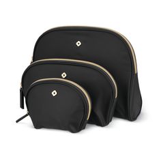 three black cosmetic bags with gold zippers