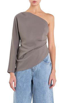 Date night is calling in this shoulder-baring top punctuated with a sleek asymmetric hem. One-shoulder neck Single long sleeve Lined 100% polyester Hand wash, dry flat Imported Chic Asymmetrical Off-shoulder Top For Spring, Spring Chic Asymmetrical Off-shoulder Top, One-sleeve Tops For Spring Evenings, One-sleeve Evening Top For Spring, One Shoulder One Sleeve Top For Fall Party, One Sleeve Top For Spring Evening, Chic Asymmetrical Long Sleeve Top For Spring, Chic One-shoulder Top With One Sleeve For Fall, Chic One Shoulder Top With One Sleeve For Fall