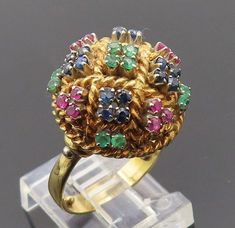 18K GOLD - Vintage Emerald Ruby & Sapphire Twist Dome Cocktail Ring Sz 5 - GR005  Jewelry Type:         Ring   Metal Type:            18K Gold   Metal Size:             5 Finger  Stone Type:            Emerald Ruby & Sapphire   Condition:              N/A  Jewelry Weight:     9.8 Grams  PLEASE NOTE: THIS ITEM IS PRE-OWNED. ALTHOUGH MOST ITEMS ARE IN VERY GOOD CONDITION, SOME MAY NEED CLEANING AND/OR MINOR REPAIRS. WE MAKE A VERY STRONG EFFORT TO UPLOAD CLEAR PICTURES. PLEASE INSPECT ALL PICTURES AND ASK ALL QUESTIONS YOU MAY HAVE PRIOR TO MAKING A PURCHASE. NOT ALL STONES ARE GENUINE, SOME ARE ENHANCED OR CREATED. Antique Gold Multi-stone Emerald Ring, Antique Gold Emerald Ring With Multi-stone, Gold Multi-stone Round Emerald Ring, Gold Multi-stone Emerald Ring, Antique Green Multi-stone Ring, Antique Jewelry Rings, Clear Pictures, Ruby Sapphire, Ring Metal