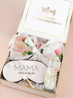 the mother's day gift box is filled with pink flowers and personalized items