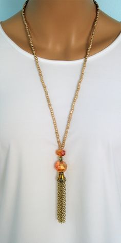 Crystal and Gold Beaded Necklaces with gold chain tassels, handmade by Ralston Originals. These beautiful beaded necklaces come in your choice of 3 different Styles. I made all the tassels with gold metal chains, and covered them with a beautiful antique gold metal bead cap. The first necklace (pictures 1-3) is made with a large round sparkling golden crystal bead, a rectangle shaped golden crystal bead, and a gold metal bead in between the two crystals. The beaded chain is made with gold seed b Dressy Jewelry, Beautiful Beaded Necklaces, Woman In Gold, Three Necklaces, Steampunk Necklace, Long Necklaces, Gold Bead Necklace, Long Beaded Necklace, Eyeglass Chain