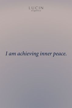 the words i am achieving inner peace are written in blue ink on a gray background