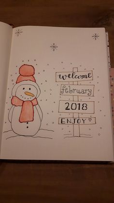 an open notebook with a drawing of a snowman and the words welcome february 2013