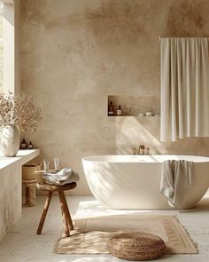 a bath tub sitting next to a window in a bathroom