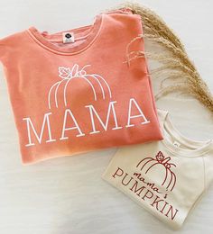 MAMA & MINI HALLOWEEN SWEATSHIRTS/TEES PICTURED: Mama Sweatshirt in PUMPKIN with white vinyl, Mini Sweatshirt in SAND with texas orange vinyl This MAMA & MINI bundle is such a fun way to match your little this Fall/Halloween! They are also an incredible, heartfelt gift :) PRICING: The item pricing goes as follows and will include TWO items (MAMA and MAMA'S PUMPKIN) - sweatshirt & sweatshirt - $75 CAD - sweatshirt & tshirt - $65 CAD - tshirt & tshirt - $50 CAD TEXT COLOUR: We will print your tran Fall Mommy And Me Shirts, Fall Mama Sweatshirts, Orange Vinyl, Mama Sweater, Mama And Mini, Spooky Mama, Pumpkin Sweatshirt, Matching Hoodies, Pumpkin Sweatshirts