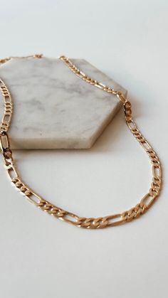 Finally our most popular layering chains are now available in 14K gold filled. Water resistant, our bold chains are a simple way to make a big statement. Wear alone or layered! Choose your length and create your layering style! Gold Filled 14k is bonded to other metals (typically a fine jewelers brass core) and is 30 - 50 times thicker than high quality plated gold. Durable & tarnish resistant, gold filled quality product is suitable for daily wear and is also water resistant. Yes, you can get t Classic 14k Gold Chunky Chain Necklace, Classic 14k Gold Chain Necklace With Chunky Chain, Everyday 14k Gold Chunky Chain Necklace, 14k Gold Filled Figaro Link Chain Necklace, Everyday Figaro Chain Necklace With Rectangular Links, 14k Gold-filled Figaro Chain Necklace, Everyday Figaro Chain Link Necklace, Classic Tarnish Resistant 14k Gold Filled Chain Necklace, Everyday Gold Plated Figaro Chain Necklace