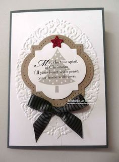 a white card with a black ribbon and a christmas tree on the front that says, my true spirit all you need is peace