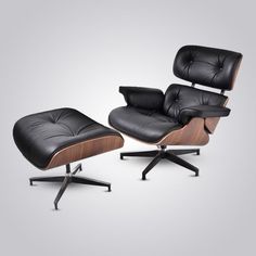 the eames lounge chair and ottoman is shown in black leather with walnut wood trim