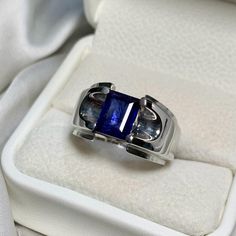 Ring Details - Natural Blue sapphire 4.00ct Approximate ( Glass Filled/ Treated) - Handmade Ring - Sterling Silver 925  - Hallmarked - Gross Weight: 20.00 grams - Dimensions and Weight Depends on Variations in Sizes. - Available in all Sizes ( Please make sure about your ring sizes) - DM for Customizations NOTE: - Our Products are Made to Order According to Customer's Expectations So It May Take Some Time. Because We Work on Our Products Very Professionally and Passionately We Will Be Very Glad Classic Sapphire Gemstones For Anniversary, Classic Sapphire Gemstones With Accent Stones, Classic Sapphire Birthstone Ring With Gemstone, Classic Sapphire Ring With Lab-created Gemstone, Gia Certified Baguette Cut Sapphire Ring, Formal Emerald Cut Sapphire Gemstones, Classic Sapphire Jewelry Gia Certified, Modern Blue Sapphire Ring, Classic Gia Certified Sapphire Jewelry