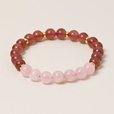 Discover the enchanting beauty of our Natural Strawberry Quartz and Rose Quartz stretch bracelet. Crafted with love and care, each bead holds the soothing energy of these gemstones. Embrace the power of nature and elevate your style with this versatile and elegant accessory. Natural Stones Stone Size 8mm Bracelet Size 17cm Handmade Spiritual Stretch Bracelet With 8mm Beads, Crystal Bracelet With Round Beads For Meditation, Meditation Crystal Bracelet With Round Beads, Elegant Rose Quartz Crystal Bracelet For Meditation, Elegant 8mm Beads Stretch Bracelet For Meditation, Elegant Stretch Bracelet With 8mm Beads For Meditation, Elegant Hand-strung Stretch Bracelet For Meditation, Elegant Gemstone Beads Stretch Bracelet For Meditation, Elegant Rose Quartz Stretch Bracelet With Round Beads