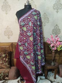 Indian Spring Shawl, Kashmiri Shawl, Kashmiri Wrap An exquisite Kashmiri Shawl With All Over Chinar-Floral Embroidery, This Kashmiri Shawl Is Customisable as per the colour and size of your Preference   Embroidery              Floral Aari Work Length / Breadth     200cm / 100 cms ( Customisable)  Fabric                     Pure Wool Colour                     Maroon ( Customisable)  Returnable          Yes Free Shipping            Yes * If you want this shawl in any other base colour, Please dro Traditional Unstitched Nida Suit, Traditional Red Dupatta With Handwork, Traditional Handwork Dupatta For Ceremonies, Ceremonial Dupatta With Multicolor Embroidery And Handwork, Traditional Silk Dupatta With Handwork, Traditional Multicolor Handwork Dupatta, Traditional Ceremonial Dupatta With Handwork, Ceremonial Dupatta With Handwork In Traditional Drape, Ceremonial Dupatta With Handwork And Traditional Drape