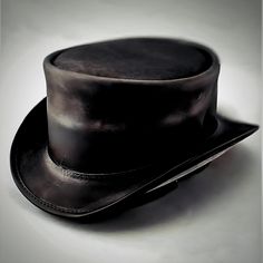 Meet the Ultimate Steampunk Top Hat, Your New Favorite Top Hat Searching for a hat that's more than just a stylish accessory? Our Men's Leather Top Hat in Midnight Black Suede is the perfect blend of vintage charm and Steampunk flair. Handcrafted with care, this hat isn't just about looking good--it's about making a statement. Note: Please read the full description and our policy below for an informed purchase. Why It Stands Out: Crafted for Quality: Every detail is meticulously designed with pr Black Steampunk Hat For Alternative Fashion, Vintage Black Hat For Alternative Fashion, Vintage Black Hats For Alternative Fashion, Gothic Brimmed Hat For Alternative Fashion, Vintage Black Hat With Flat Crown, Black Leather Top Hat With Flat Crown, Black Brimmed Punk Hat, Black Punk Brimmed Hats, Adjustable Flat Brim Costume Hat